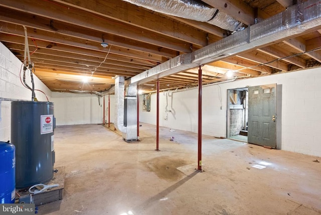 6314 Foster Rd, Spotsylvania, VA 22553 - unfinished below grade area with water heater, heating unit, a water pressure tank, and concrete block wall