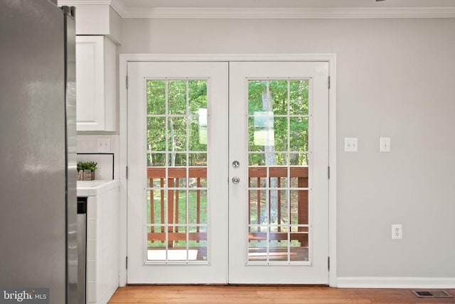 6314 Foster Rd, Spotsylvania, VA 22553 - doorway featuring ornamental molding, french doors, and plenty of natural light
