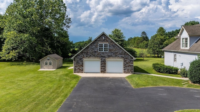 31 Hampton Dr, Stuarts Draft, VA 24477 - view of front of property featuring an outbuilding, a front lawn, a garage, and stone siding