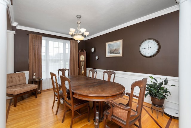 31 Hampton Dr, Stuarts Draft, VA 24477 - dining room with a chandelier, crown molding, light wood-style flooring, a wainscoted wall, and decorative columns