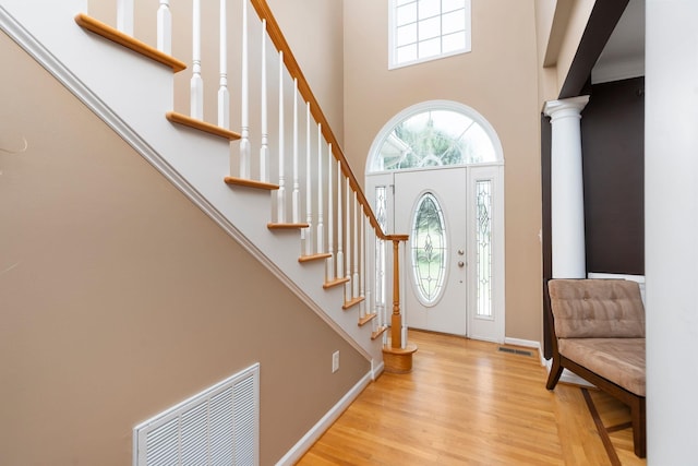 31 Hampton Dr, Stuarts Draft, VA 24477 - foyer featuring a towering ceiling, wood finished floors, stairs, and decorative columns