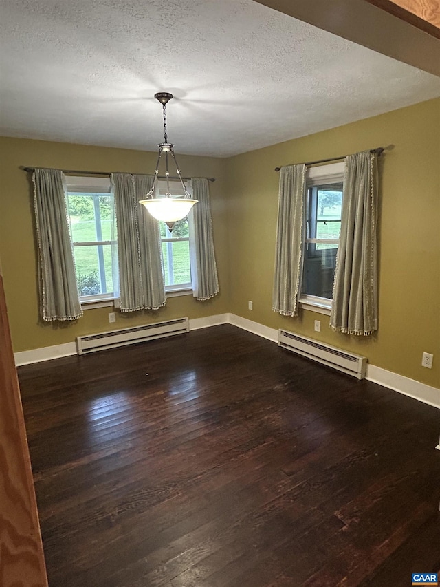 1863 River Rd, Faber, VA 22938 - empty room with baseboard heating, a baseboard radiator, dark wood finished floors, and a textured ceiling