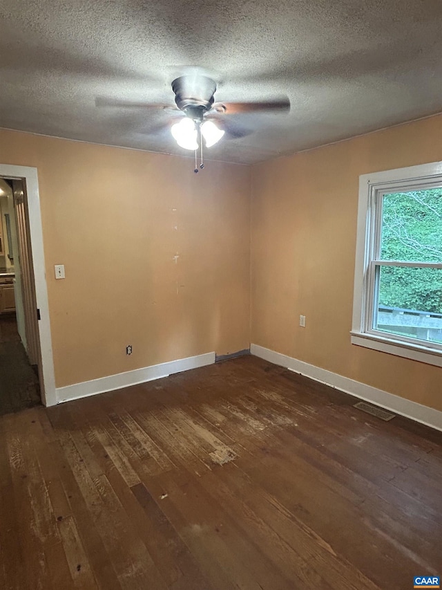 1863 River Rd, Faber, VA 22938 - unfurnished room featuring dark wood-style flooring, a ceiling fan, and a textured ceiling