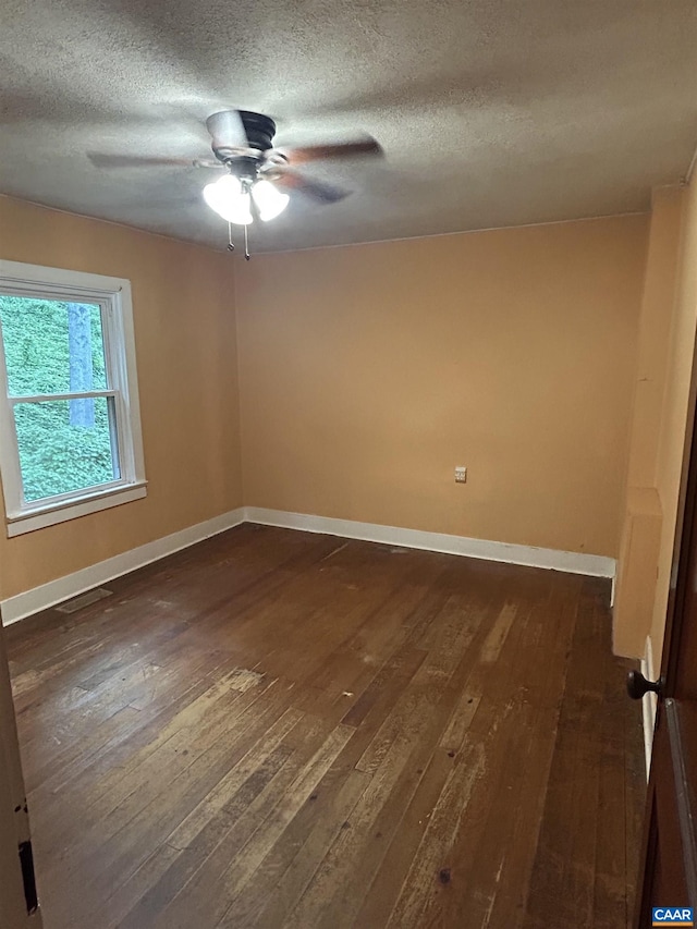 1863 River Rd, Faber, VA 22938 - spare room featuring dark wood-style floors, a ceiling fan, and a textured ceiling