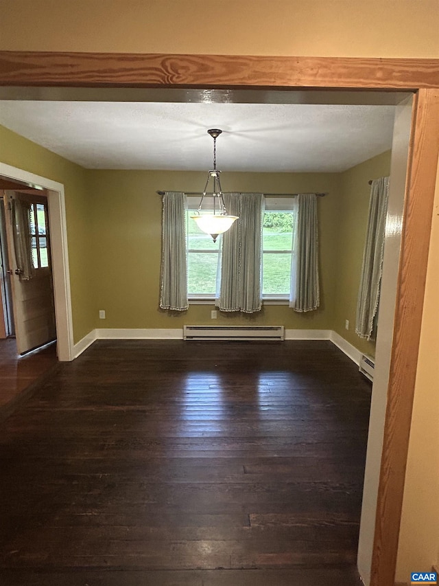 1863 River Rd, Faber, VA 22938 - unfurnished dining area featuring baseboard heating, dark wood finished floors, and a baseboard heating unit