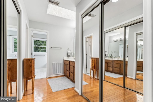 3803 Fallwood Ln, Fredericksburg, VA 22408 - bathroom with hardwood / wood-style floors, vanity, and baseboards