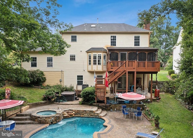 3803 Fallwood Ln, Fredericksburg, VA 22408 - back of property with an in-ground hot tub, a sunroom, a patio area, an outdoor pool, and a chimney