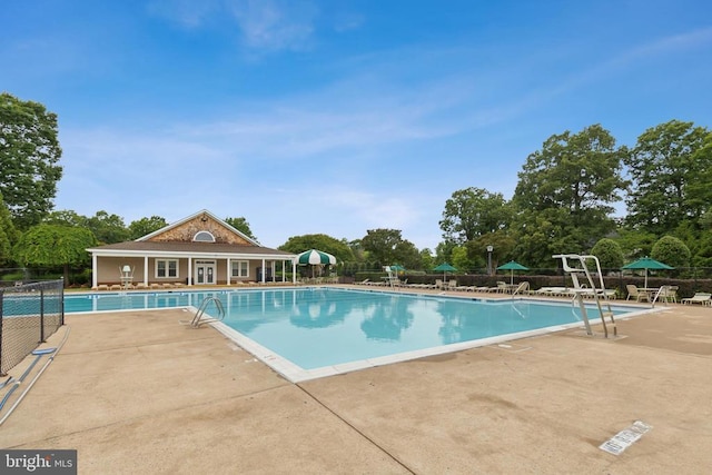 3803 Fallwood Ln, Fredericksburg, VA 22408 - community pool with a patio area and view of scattered trees