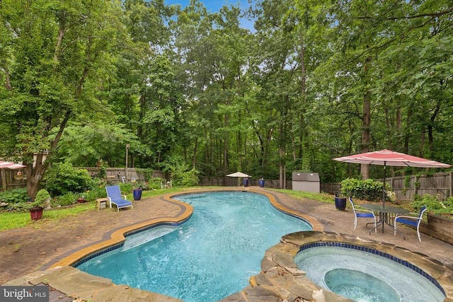 3803 Fallwood Ln, Fredericksburg, VA 22408 - view of swimming pool featuring a fenced backyard, a patio, and a pool with connected hot tub