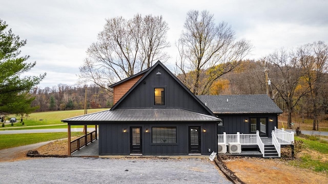 3332 Hill Gap Rd, Bridgewater, VA 22812 - view of front of property featuring board and batten siding, metal roof, covered porch, ac unit, and a deck