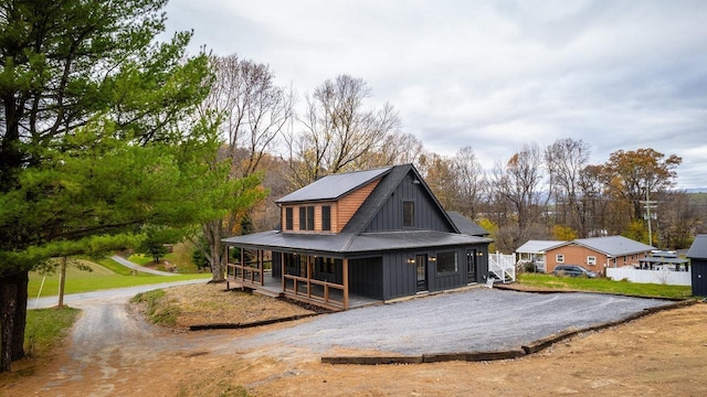 3332 Hill Gap Rd, Bridgewater, VA 22812 - rear view of house with covered porch, board and batten siding, metal roof, and aphalt driveway