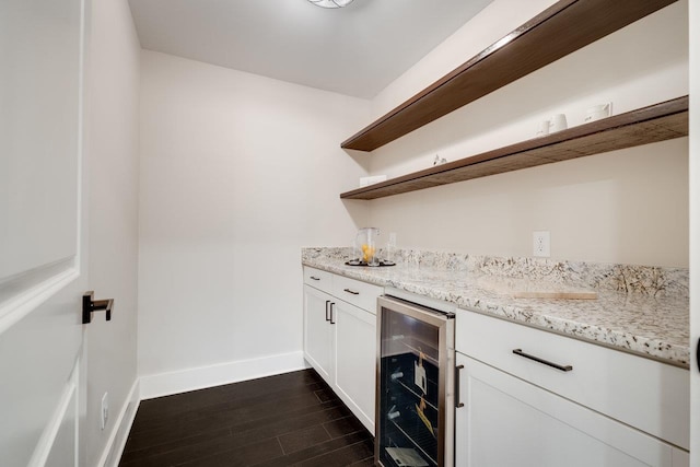 3332 Hill Gap Rd, Bridgewater, VA 22812 - bar featuring wine cooler, a bar, baseboards, and dark wood-type flooring