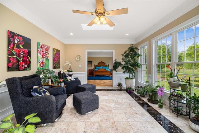 515 Legrande Ave, Waynesboro, VA 22980 - living area with crown molding, a decorative wall, marble tiled flooring, wainscoting, and ceiling fan