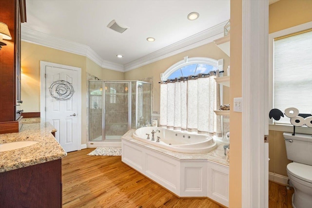 515 Legrande Ave, Waynesboro, VA 22980 - bathroom with a stall shower, a tub with jets, vanity, wood finished floors, and ornamental molding
