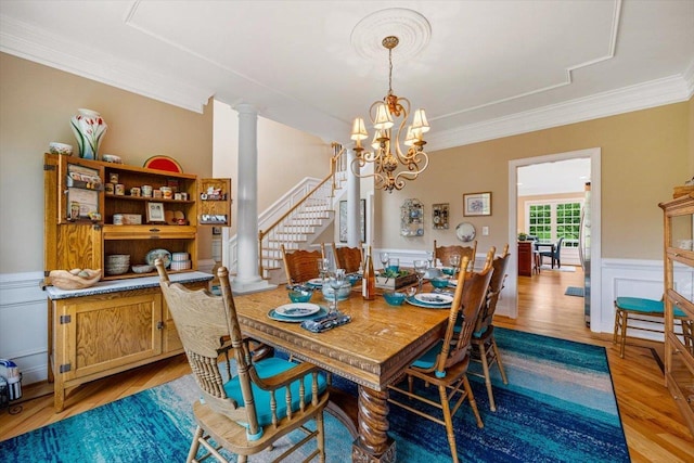 515 Legrande Ave, Waynesboro, VA 22980 - dining area with stairs, a chandelier, crown molding, wainscoting, and light wood-style floors