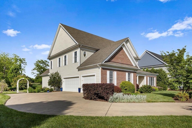 515 Legrande Ave, Waynesboro, VA 22980 - view of side of property featuring an attached garage, driveway, brick siding, a yard, and a shingled roof