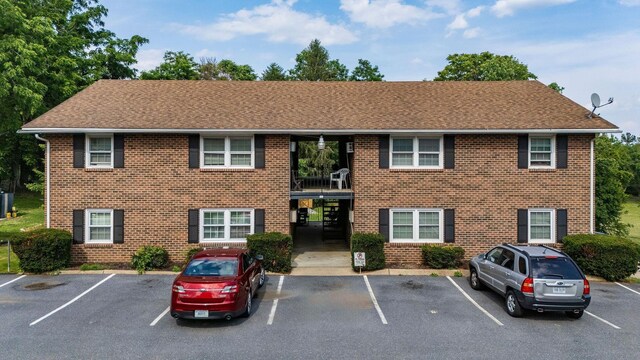 65 Woodlee Rd, Staunton, VA 24401 - view of front of house with brick siding, uncovered parking, and roof with shingles