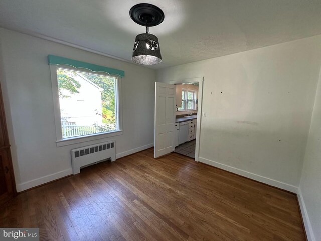 2 Terrace Ln, Luray, VA 22835 - unfurnished bedroom with radiator heating unit and wood finished floors