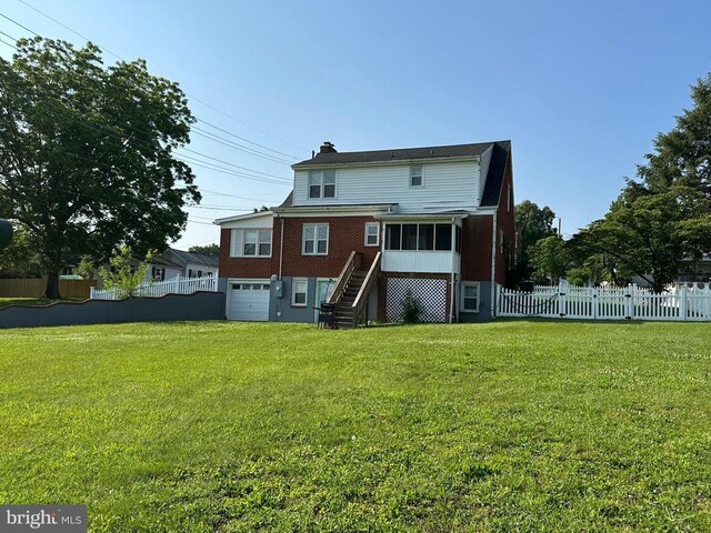 2 Terrace Ln, Luray, VA 22835 - back of house with stairs, brick siding, a chimney, an attached garage, and a sunroom