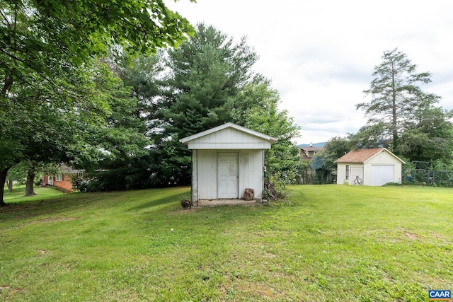613 6th St, Shenandoah, VA 22849 - view of green lawn with a storage unit and a garage