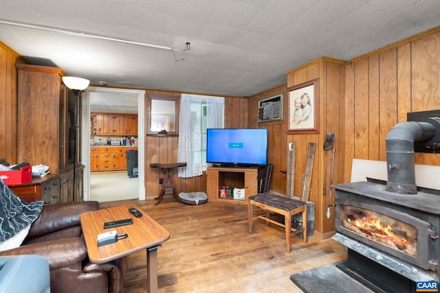 613 6th St, Shenandoah, VA 22849 - living area featuring a wood stove, wood walls, and wood finished floors