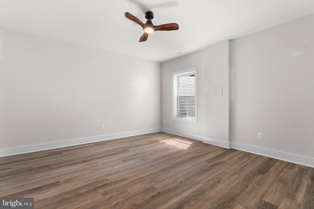  - unfurnished room featuring wood finished floors and a ceiling fan