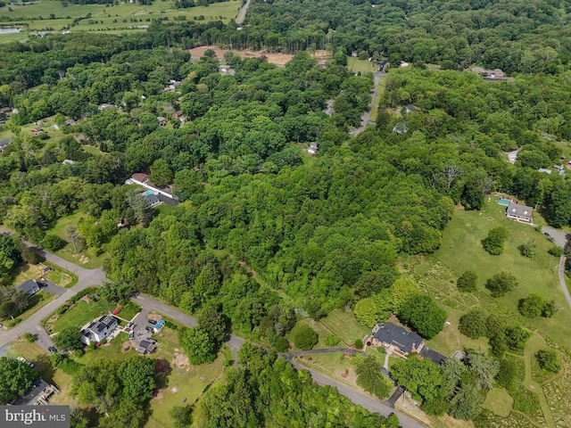  - view of property location featuring a forest