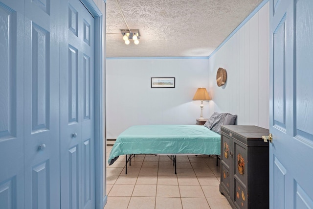 1233 Pinehurst Rd, Staunton, VA 24401 - bedroom with light tile patterned floors, a textured ceiling, and baseboard heating