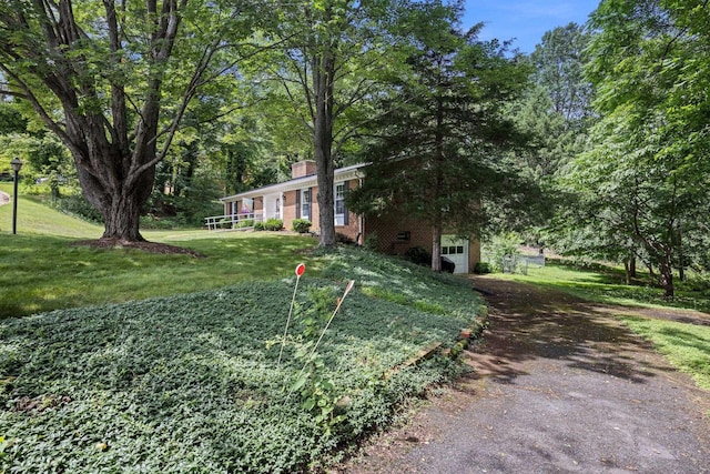 1233 Pinehurst Rd, Staunton, VA 24401 - view of front facade with a chimney, a front lawn, driveway, and brick siding