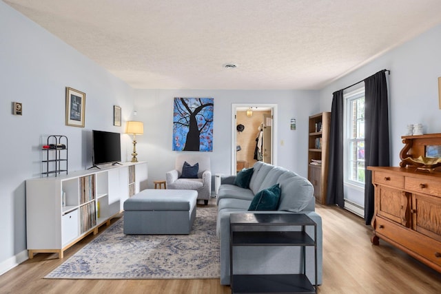 1233 Pinehurst Rd, Staunton, VA 24401 - living room with a baseboard radiator, a textured ceiling, and wood finished floors