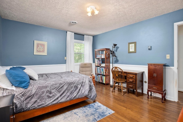 1233 Pinehurst Rd, Staunton, VA 24401 - bedroom featuring a textured ceiling, a wainscoted wall, and wood finished floors