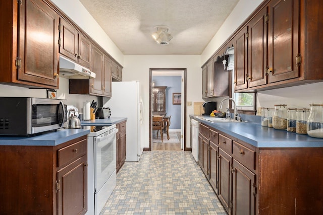 1233 Pinehurst Rd, Staunton, VA 24401 - kitchen with white appliances, under cabinet range hood, dark countertops, and a textured ceiling
