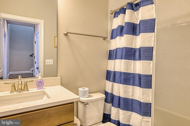 bathroom featuring vanity, toilet, and shower / tub combo with curtain