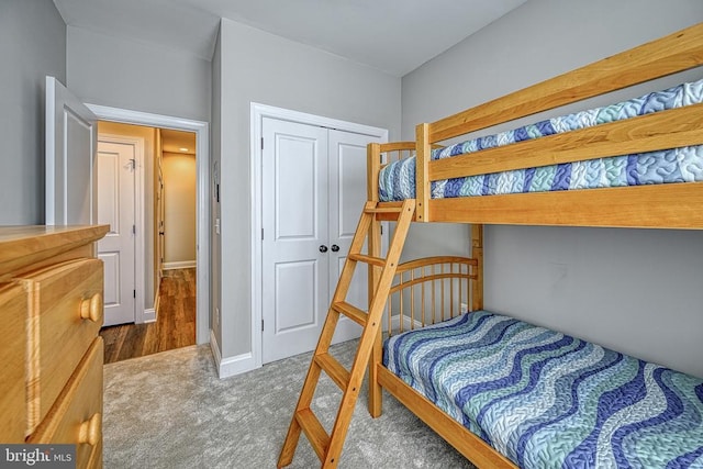 bedroom featuring carpet and a closet
