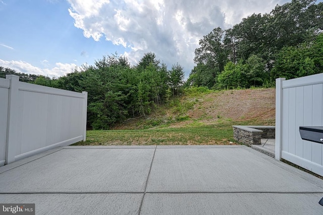 view of patio featuring fence