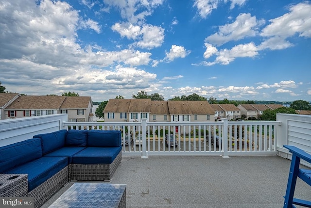 view of patio featuring an outdoor hangout area, a residential view, and a balcony