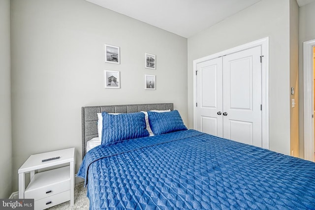 carpeted bedroom featuring a closet