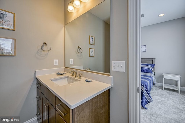 bathroom with vanity and baseboards