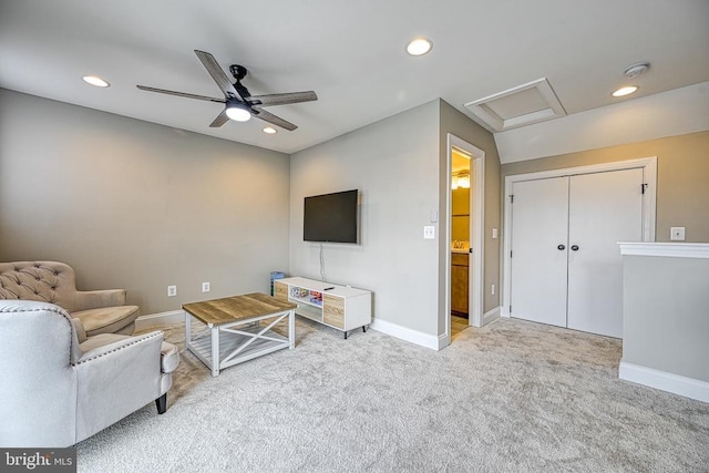 carpeted living area featuring attic access, recessed lighting, baseboards, and a ceiling fan