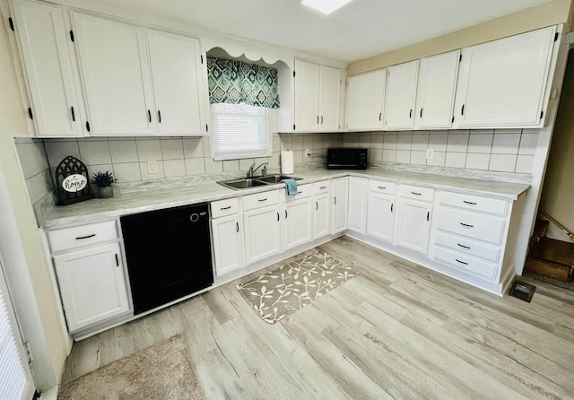 1204 3rd St, Waynesboro, VA 22980 - kitchen featuring white cabinetry, black appliances, light wood-style floors, and a sink