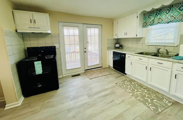 1204 3rd St, Waynesboro, VA 22980 - kitchen featuring a sink, french doors, black appliances, under cabinet range hood, and light wood finished floors