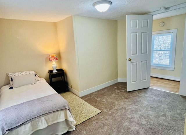 1204 3rd St, Waynesboro, VA 22980 - carpeted bedroom featuring a textured ceiling and baseboards
