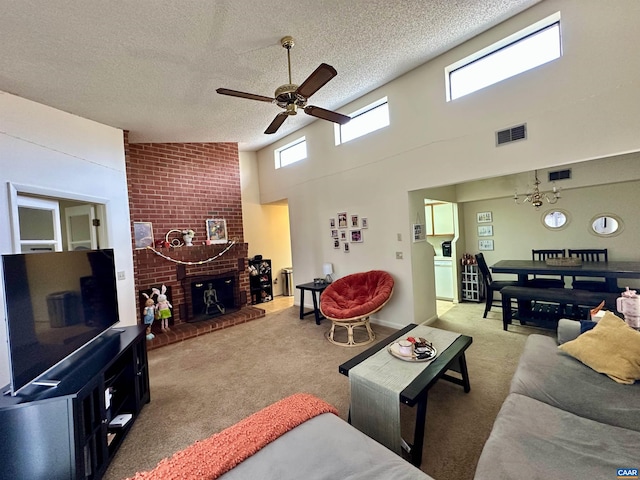 103 Turtle Creek Rd Unit 10, Charlottesville, VA 22901 - carpeted living area featuring ceiling fan, a textured ceiling, a towering ceiling, and a fireplace