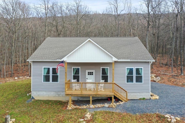 115 Mountain Top Ln, New Market, VA 22844 - view of front facade featuring a front yard, a wooded view, roof with shingles, and a wooden deck