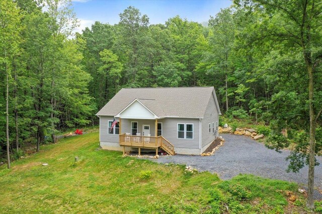 115 Mountain Top Ln, New Market, VA 22844 - view of front of house with a wooded view, roof with shingles, a porch, and a front yard