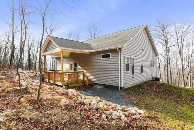115 Mountain Top Ln, New Market, VA 22844 - view of property exterior featuring a wooden deck, a shingled roof, and central AC