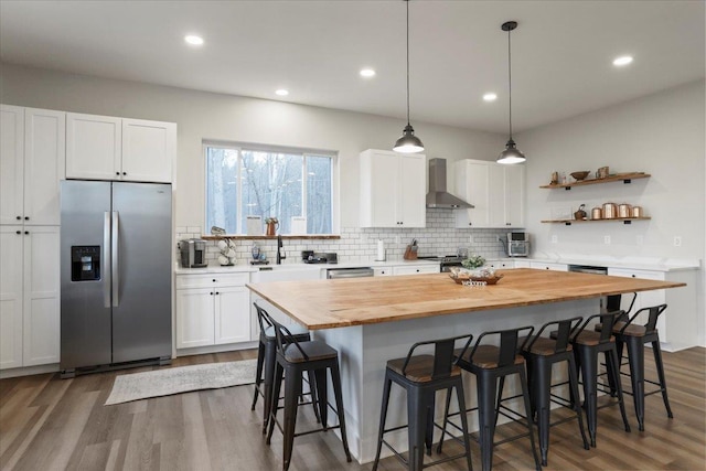 115 Mountain Top Ln, New Market, VA 22844 - kitchen featuring butcher block countertops, wall chimney exhaust hood, dark wood-style flooring, white cabinetry, and stainless steel fridge with ice dispenser