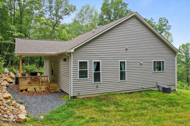 115 Mountain Top Ln, New Market, VA 22844 - rear view of house with a wooden deck, central AC unit, a lawn, and a shingled roof