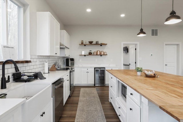 115 Mountain Top Ln, New Market, VA 22844 - kitchen with range with electric cooktop, built in microwave, butcher block countertops, and beverage cooler
