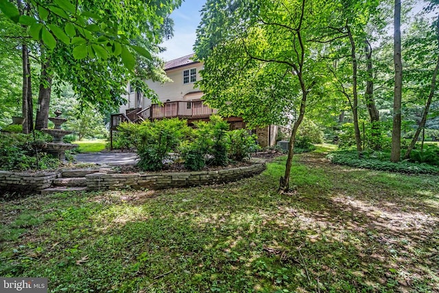  - view of yard featuring a deck